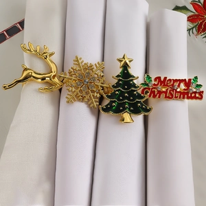 Christmas napkin ring set with golden deer, snowflake, tree and Merry Christmas motifs
