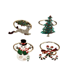 Christmas napkin ring set with reindeer, tree, snowman and candy cane designs