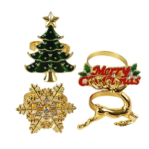 Christmas napkin ring set with gold metal deer, tree and snowflake designs