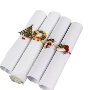 Set of 4 festive Christmas napkin rings with tree, wreath, boot and hat designs