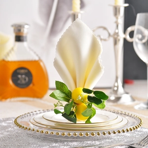Handmade lemon napkin ring with green leaves and white flowers for elegant table decor