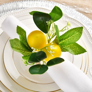 Close-up of handmade lemon napkin ring with realistic greenery and white flowers