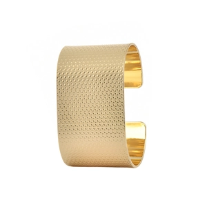 Polished matte gold wide C-shaped metal napkin ring with diamond textured surface