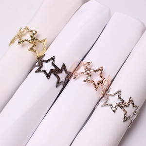 Hollow pentagram napkin rings in gold, black, rose gold, and silver for table decor