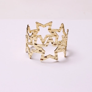 Golden hollow pentagram star napkin ring holder for elegant Christmas dinner table setting