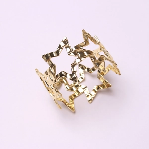Golden 3D hollow star napkin ring with polished finish for creative table decor