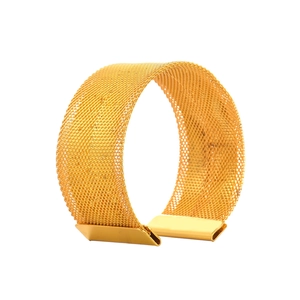 Elegant gold metal mesh napkin ring featuring a wide luxury weave for fine dining table decor