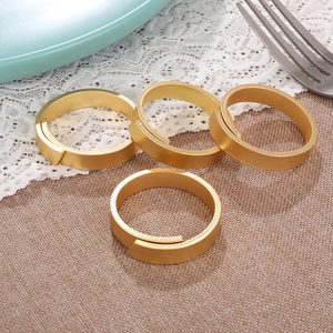 Set of 4 matte gold adjustable metal napkin rings for elegant dining table settings