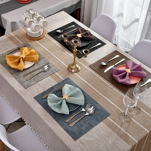 Elegant ginkgo leaf napkin rings and woven placemats set in various colors for table decor