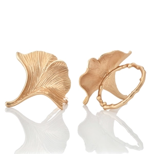 Golden ginkgo leaf napkin rings with brushed metal texture and realistic veins