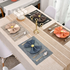 Elegant four-color placemat set with matching napkins and golden flower napkin rings