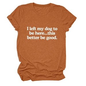 Close-up of orange crew neck t-shirt with white I left my dog text print detail