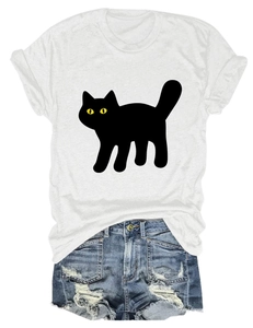 Close-up of white crew neck T-shirt featuring a cute black cat graphic with yellow eyes