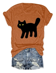 Casual summer outfit featuring orange cat print T-shirt and distressed blue denim shorts