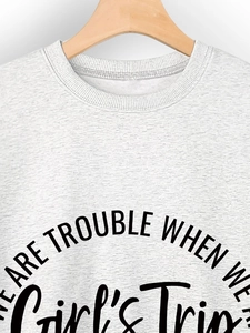 Detail of Girl's Trip slogan print on grey marl cotton blend sweatshirt neckline