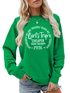 Detail of green crewneck sweatshirt with white Girl's Trip circular slogan print