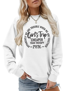 Detail of white cotton sweatshirt featuring Girl's Trip and Cheaper Than Therapy print