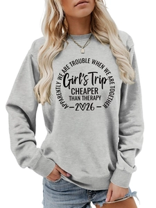 Detail of grey crewneck sweatshirt featuring Girl's Trip slogan and ribbed cuffs