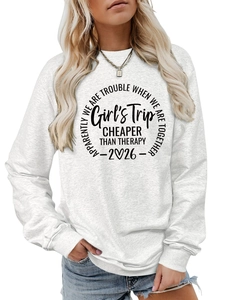 Close-up of Girl's Trip lettering on light gray crewneck sweatshirt fabric