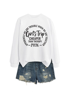 Detail of white crewneck sweatshirt with black Girls Trip text and denim shorts