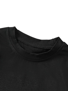 Close-up of the ribbed crew neck and stitching on a premium black cotton kids' T-shirt