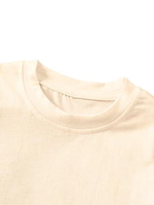 Close-up of beige kids' shirt collar with neat ribbing and soft knit fabric texture