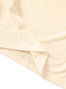 Detail of double-needle stitching and high-quality hem on a beige kids cotton knit t-shirt