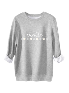 Détail du sweat gris Auntie avec imprimé marguerites et doublure polaire chaude