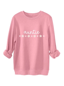 Vue détaillée du sweat rose Auntie avec imprimé marguerite et finitions côtelées