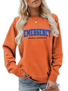 Detail of ribbed cuffs and Medical Technician print on an orange crewneck sweatshirt