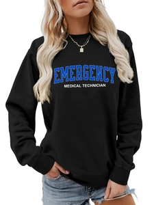 Detail of the blue Emergency Medical Technician print on a black long sleeve sweatshirt