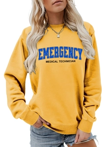 Detail of yellow crewneck sweatshirt with emergency medical technician print and ribbed cuffs
