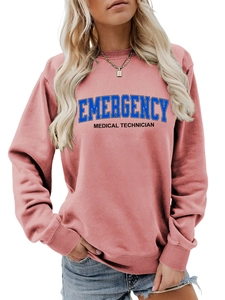 Detail of dusty rose sweatshirt with Emergency Medical Technician print and ribbed cuffs