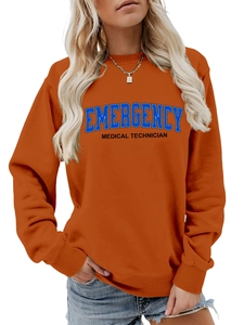 Macro shot of burnt orange sweatshirt showing ribbed neckline and medical technician print