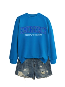 Detail of royal blue crew neck sweatshirt with white emergency medical technician lettering