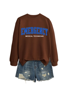 Flat lay of brown emergency medical crewneck sweatshirt with distressed denim shorts