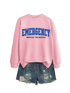 Close-up of pink crewneck sweatshirt with blue Emergency Medical Technician text and frayed denim