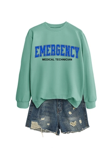 Detail of mint green sweatshirt with Emergency Medical Technician print and denim shorts