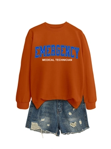 Detail of orange sweatshirt with Emergency Medical Technician text and denim shorts