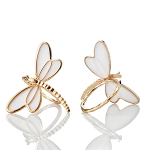 Elegant gold-plated dragonfly napkin rings with white enamel heart-shaped wings