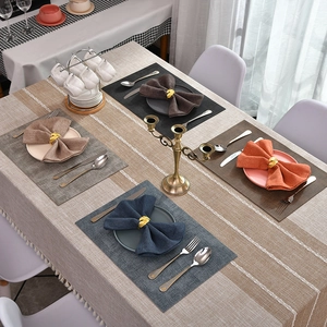 Golden leaf napkin rings with assorted fabric placemats for luxury table decoration