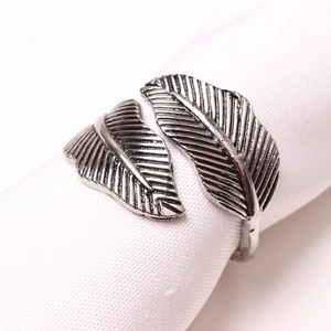 Macro shot of an adjustable silver feather ring with vintage oxidized metal texture