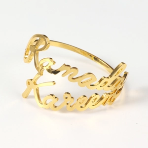 Polished gold alloy napkin ring featuring decorative Ramadan Kareem lettering detail