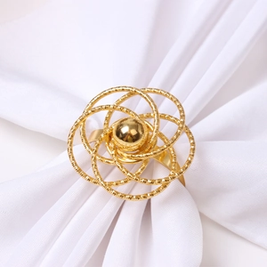 Elegant gold metal hollow rose napkin ring with spiral flower design for table setting