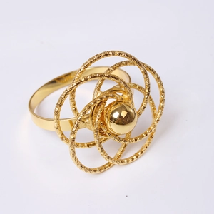 Detailed view of golden hollow rose napkin ring with brushed texture and mirror center