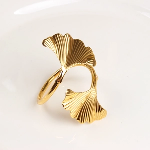 Ginkgo leaf napkin ring in golden finish with detailed vein texture for wedding table decor