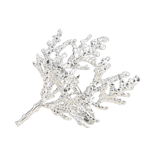 Detailed close-up of a silver coral branch napkin ring with intricate metallic textures