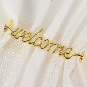 Portatovagliolo dorato Welcome in metallo con finitura lucida per decoro tavola hotel