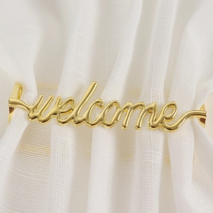 Portatovagliolo dorato con scritta welcome in metallo lucido per decorazione tavola