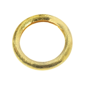 Elegant gold round napkin ring with textured hammered surface on white background